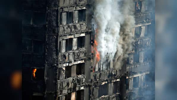 Theresa May says inflammable coating found in many residential tower blocks in UK