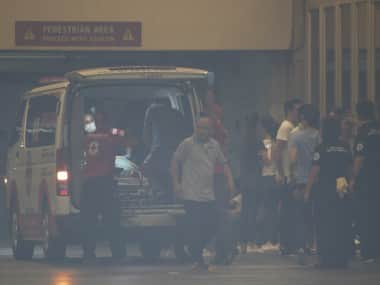 People being taken to hospitals in ambulances after the attack. AP