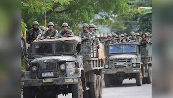 Philippines violence: Dozens flee Islamist gunmen in war-torn Marawi