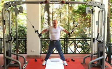 Behind the iron curtain: Vladimir Putin's fitness secrets include swimming and playing with his dog Behind the iron curtain: Vladimir Putin's fitness secrets include swimming and playing with his dog