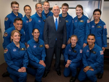 Indian American astronaut Raja Chari (kneeling extreme right) in a group photo of NASA's 12 new astronaut candidates with US Vice President Mike Pence in Houston Texas. Reuters