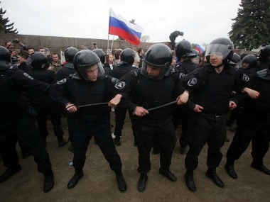 Police detain protesters during an unauthorised protest in Russia. Getty Images