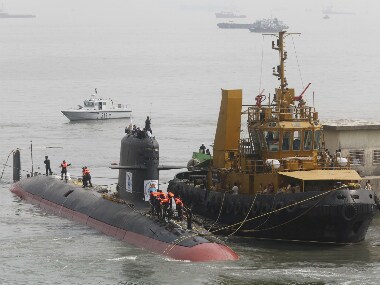 File photo of Indian Navy's Scorpene submarine INS Kalvari being escorted by tugboats as it arrives at Mazagon Docks Ltd in Mumbai. Reuters