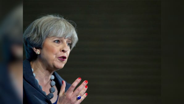 Theresa May reassures EU citizens in UK: 'We want you to stay' after Brexit