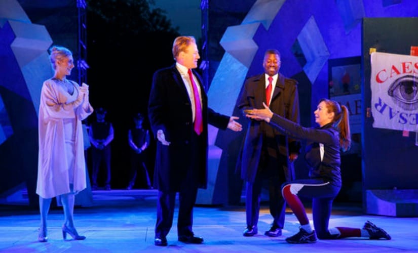 In this file image provided by The Public Theater, Tina Benko, left, portrays Melania Trump and Gregg Henry, center left, portrays President Donald Trump in the role of Julius Caesar during a dress rehearsal in New York. AP