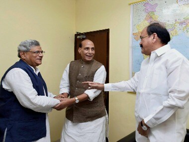 Sitaram Yechury with Venkaiah Naidu and Rajnath Singh. PTI