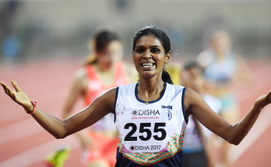 Archana Adhav celebrates after winning gold in the women's 800m. However, she was disqualified for pushinh an opponent during the race. AFP Archana Adhav celebrates after winning gold in the women's 800m. However, she was disqualified for pushinh an opponent during the race. AFP
