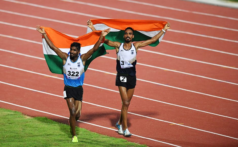 G Lakshmanan (L) and Gopi Thonakal celebrate after winning gold and silver respectively in the men's 10,000m. AFP G Lakshmanan (L) and Gopi Thonakal celebrate after winning gold and silver respectively in the men's 10,000m. AFP