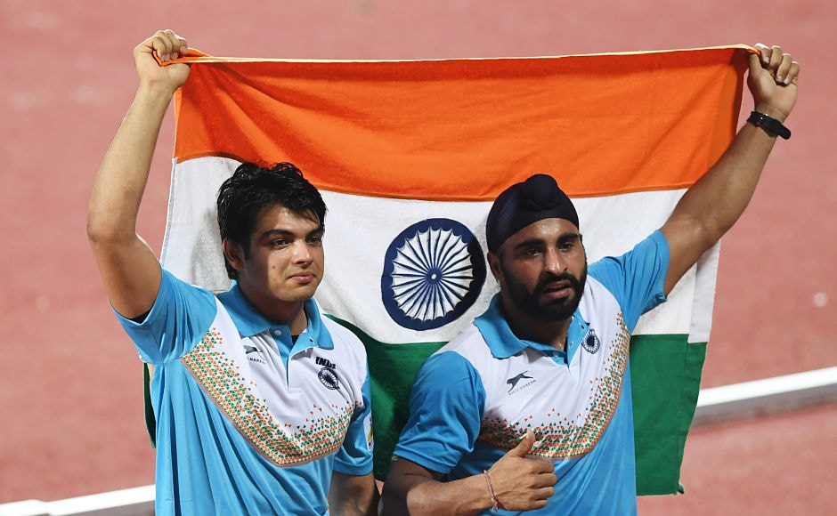 Neeraj Chopra (L) and Davinder Singh Kang celebrate after placing first and third, respectively, in the javelin throw event. AFP Neeraj Chopra (L) and Davinder Singh Kang celebrate after placing first and third, respectively, in the javelin throw event. AFP