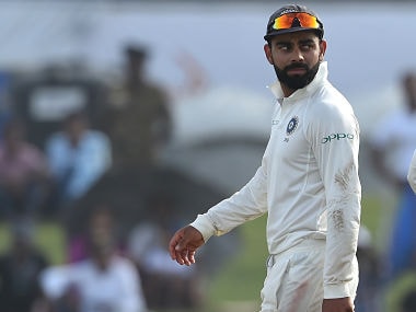 Indian cricket team captain Virat Kohli leaves the pitch after the fourth day of the first Test match between Sri Lanka and India at Galle International Cricket Stadium in Galle on July 29, 2017. Virat Kohli's India thrashed Sri Lanka by 304 runs inside four days on July 28 to claim the first Test in their three-match series. / AFP PHOTO / ISHARA S. KODIKARA