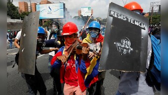 'Symphony of protests' across Venezuela as violinist's musical resistance goes viral