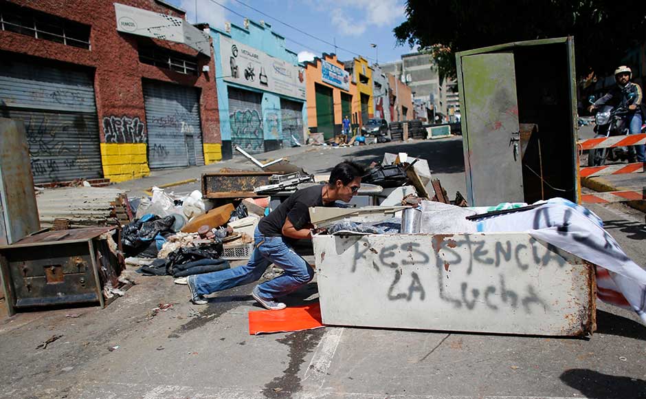 Protesters attacked polling stations and barricaded streets around the country, drawing a bloody response from security forces, which opened fire with live ammunition in some cases. During the election, Venezuelans abstained in massive numbers in a show of silent protest. AP Protesters attacked polling stations and barricaded streets around the country, drawing a bloody response from security forces, which opened fire with live ammunition in some cases. During the election, Venezuelans abstained in massive numbers in a show of silent protest. AP