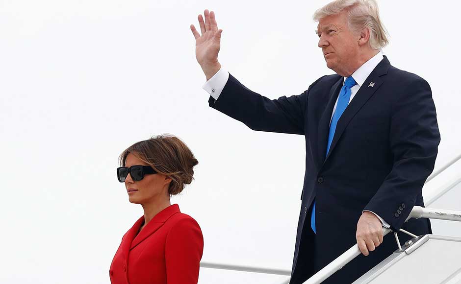 Accompanied by First Lady Melania Trump, the 71-year-old stepped onto French soil for the first time as president, hoping to leave behind weighty allegations that his family and inner circle colluded with Russia to win the 2016 US election. AP Accompanied by First Lady Melania Trump, the 71-year-old stepped onto French soil for the first time as president, hoping to leave behind weighty allegations that his family and inner circle colluded with Russia to win the 2016 US election. AP