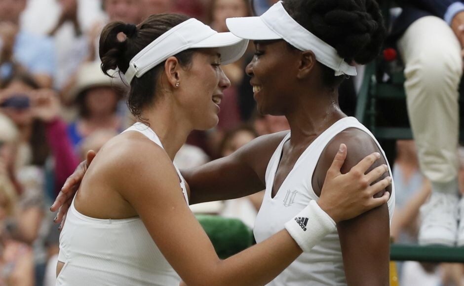 Muguruza won nine straight games to win Wimbledon adding to last year's French Open. The two players hug at the net after the final. AP Muguruza won nine straight games to win Wimbledon adding to last year's French Open. The two players hug at the net after the final. AP