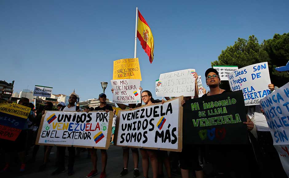 Venezuelans also protested in Miami, Madrid and various Latin American cities in solidarity with the protestors. The number of Venezuelans living abroad has soared, as the once-booming oil producer has descended into a devastating economic crisis marked by shortages, runaway inflation, riots and looting. AP Venezuelans also protested in Miami, Madrid and various Latin American cities in solidarity with the protestors. The number of Venezuelans living abroad has soared, as the once-booming oil producer has descended into a devastating economic crisis marked by shortages, runaway inflation, riots and looting. AP