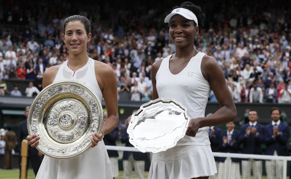 Garbine Muguruza holds the Venus Rosewater Dish while Venus Williams (R) holds the runners-up trophy at Wimbledon. AP Garbine Muguruza holds the Venus Rosewater Dish while Venus Williams (R) holds the runners-up trophy at Wimbledon. AP