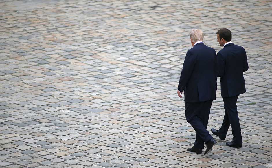Sources at the White House and in the French presidency insist ties are healthy even after a muscular handshake seen as a battle of wills between the two of them when they first met at a NATO summit in May. AP Sources at the White House and in the French presidency insist ties are healthy even after a muscular handshake seen as a battle of wills between the two of them when they first met at a NATO summit in May. AP