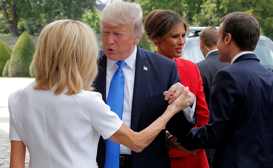 Later on Thursday, the leaders and their wives Brigitte and Melania shared a Michelin-starred dinner at the Eiffel Tower, part of Macron's charm offensive. Trump complimented 64-year-old Brigitte, Macron's former schoolteacher, during their visit to the museum. Later on Thursday, the leaders and their wives Brigitte and Melania shared a Michelin-starred dinner at the Eiffel Tower, part of Macron's charm offensive. Trump complimented 64-year-old Brigitte, Macron's former schoolteacher, during their visit to the museum.