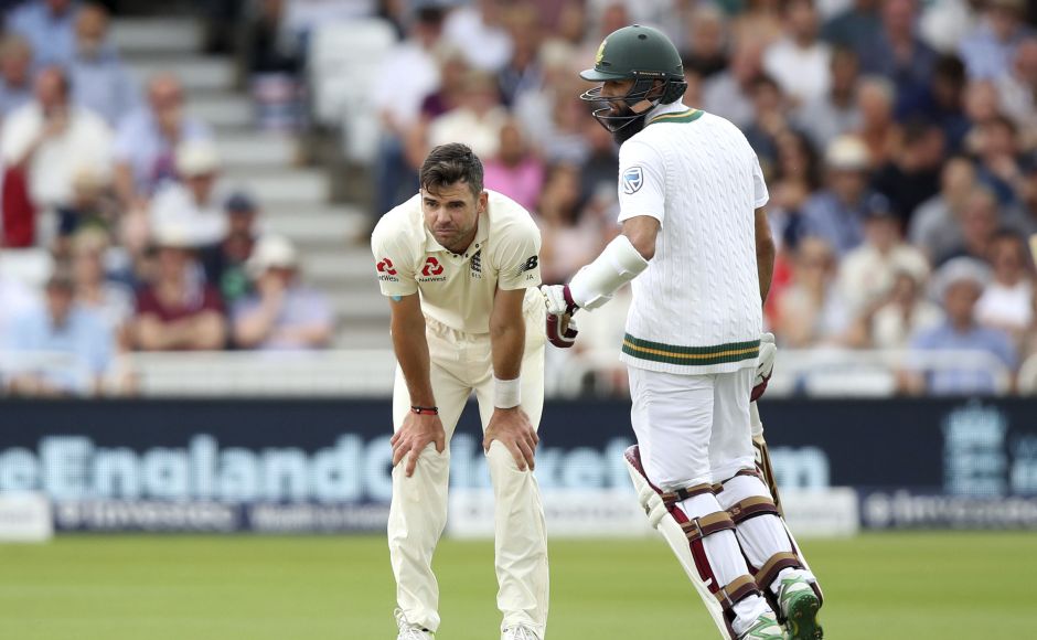 James Anderson with hands on his knees while Hashim Amla (R) jogged for a run signified England's position in the Test. AP
