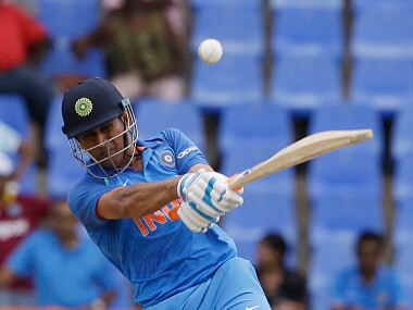 India's MS Dhoni plays a shot from the bowling of West Indies' captain Jason Holder during their third ODI cricket match at the Sir Vivian Richards Stadium in North Sound, Antigua and Barbuda, Friday, June 30, 2017. (AP Photo/Ricardo Mazalan)