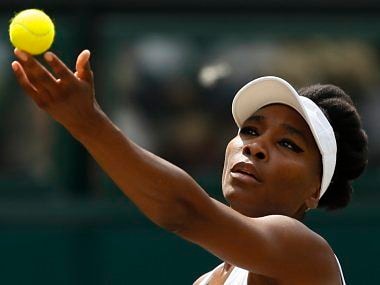 Venus Williams of the United States serves to Croatia's Ana Konjuh during their Women's Singles Match on day seven at the Wimbledon Tennis Championships in London Monday, July 10, 2017. (AP Photo/Kirsty Wigglesworth)