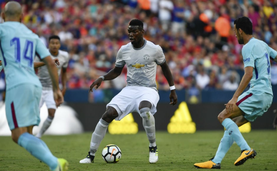 Manchester United's Paul Pogba tries to spread the play against Barcelona. AP Manchester United's Paul Pogba tries to spread the play against Barcelona. AP