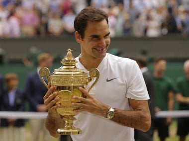 Switzerland's Roger Federer holds the trophy after defeating Croatia's Marin Cilic to win the Men's Singles final match on day thirteen at the Wimbledon Tennis Championships in London Sunday, July 16, 2017. (AP Photo/Alastair Grant)