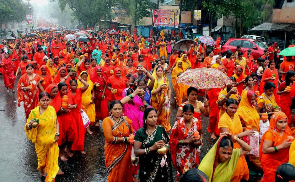 In Jamshedpur, Hindu devotees carried water in urn to offer it to lord Shiva. PTI