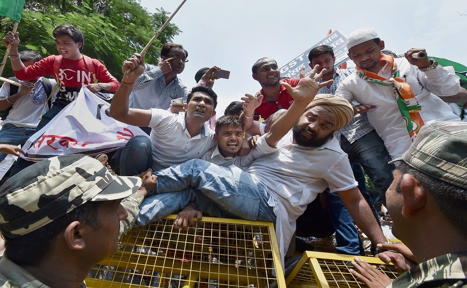 Shouting slogans and carrying placards against the government, the Congress workers marched from Jantar Mantar towards Parliament, but were stopped halfway by police barricades. PTI Shouting slogans and carrying placards against the government, the Congress workers marched from Jantar Mantar towards Parliament, but were stopped halfway by police barricades. PTI