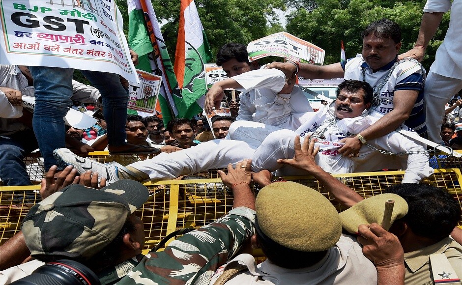 Delhi Congress chief Ajay Maken leading the protest said that, the government has implemented the GST to help its rich and industrialist friends. He also added that the party workers would go to every nook and corner to protest current GST form. PTI Delhi Congress chief Ajay Maken leading the protest said that, the government has implemented the GST to help its rich and industrialist friends. He also added that the party workers would go to every nook and corner to protest current GST form. PTI