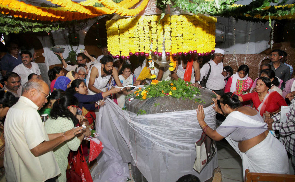 In Mumbai, devotees offered prayers to Lord Shiva at Kopineswar Temple in Thane, Mumbai on Monday. PTI