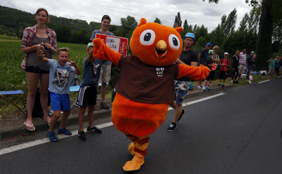 Supporters cheer the riders during the tenth stage of the Tour de France cycling race over 178 kilometers (110.6 miles) with start in Perigueux and finish in Bergerac, France. AP