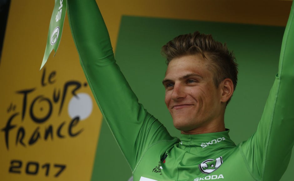 Germany's Marcel Kittel, wearing the best sprinter's green jersey celebrates on the podium after winning the tenth stage of the Tour de France cycling race over 178 kilometers (110.6 miles) with start in Perigueux and finish in Bergerac. AP