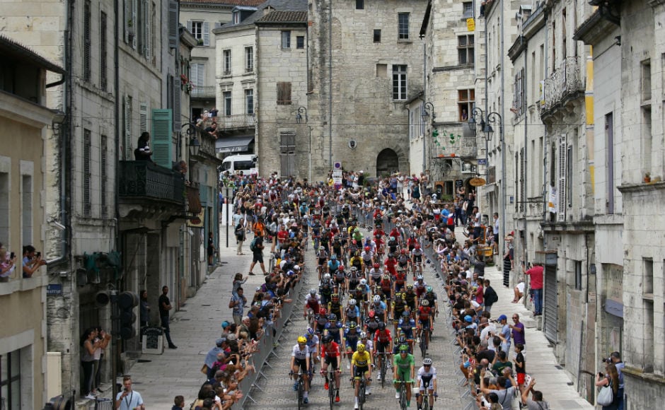 The pack rides in Perigueux during the tenth stage of the Tour de France cycling race over 178 kilometers (110.6 miles) with start in Perigueux and finish in Bergerac. AP