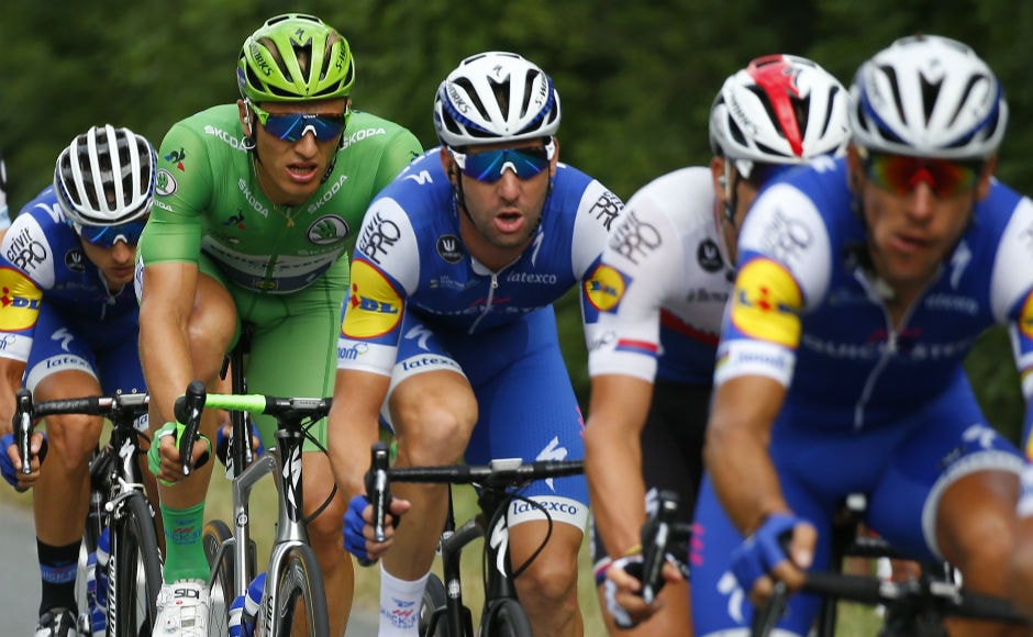 Teammates set the pace for stage winner Germany's sprinter Marcel Kittel, wearing the best sprinter's green jersey, at the front of the pack during the tenth stage of the Tour de France cycling race over 178 kilometers (110.6 miles) with start in Perigueux and finish in Bergerac. AP