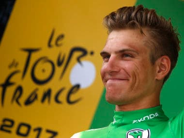 Germany's Marcel Kittel, wearing the best sprinter's green jersey celebrates on the podium after winning the tenth stage of the Tour de France cycling race over 178 kilometers (110.6 miles) with start in Perigueux and finish in Bergerac, France, Tuesday, July 11, 2017. (AP Photo/Christophe Ena)