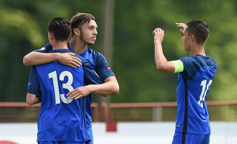 Amine Gouiri of France (second left) celebrates with teammates after scoring his side's first goal during their FIFA U-17 World Cup play-off match. UEFA