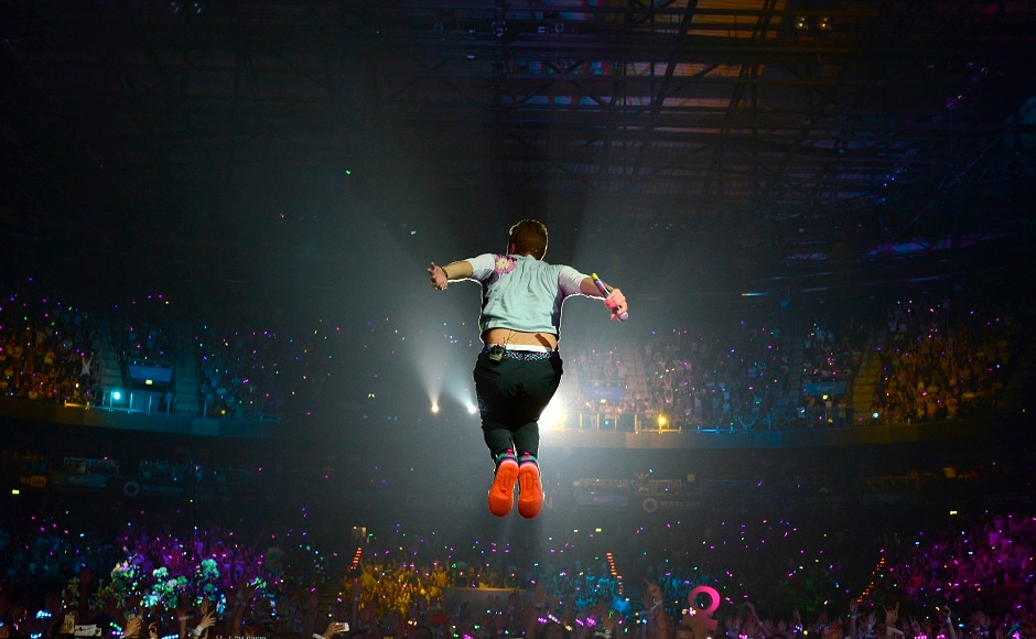 Singer Chris Martin, of the band Coldplay, performs at the Global Citizen Festival concert on the eve of the G-20 summit in Hamburg, northern Germany, Thursday, July 6, 2017. The leaders of the group of 20 meet July 7 and 8. (AP Photo/Jens Meyer)
