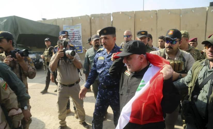 Haider al-Abadi congratulates his troops. AP