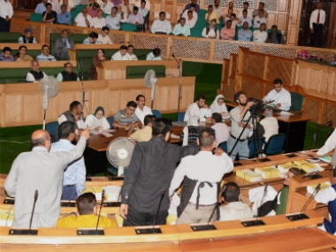 National Conference and Congress MLA's shout slogans Legislative Assembly in Srinagar on Tuesday. PTI