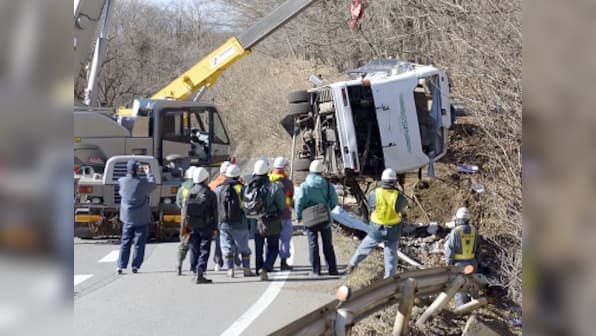 China bus accident: At least 19 killed after coach flips on highway in Guangdong