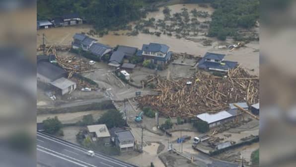 Huge floods sweep southern Japan, two dead, 18 missing
