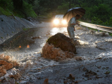 Japan floods: Death toll climbs to 25, rescue teams battle through thick mud to save stranded Japan floods: Death toll climbs to 25, rescue teams battle through thick mud to save stranded