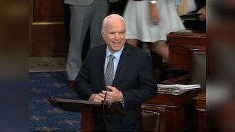 John McCain returns to US Senate to applause, votes to open debate on Obamacare repeal