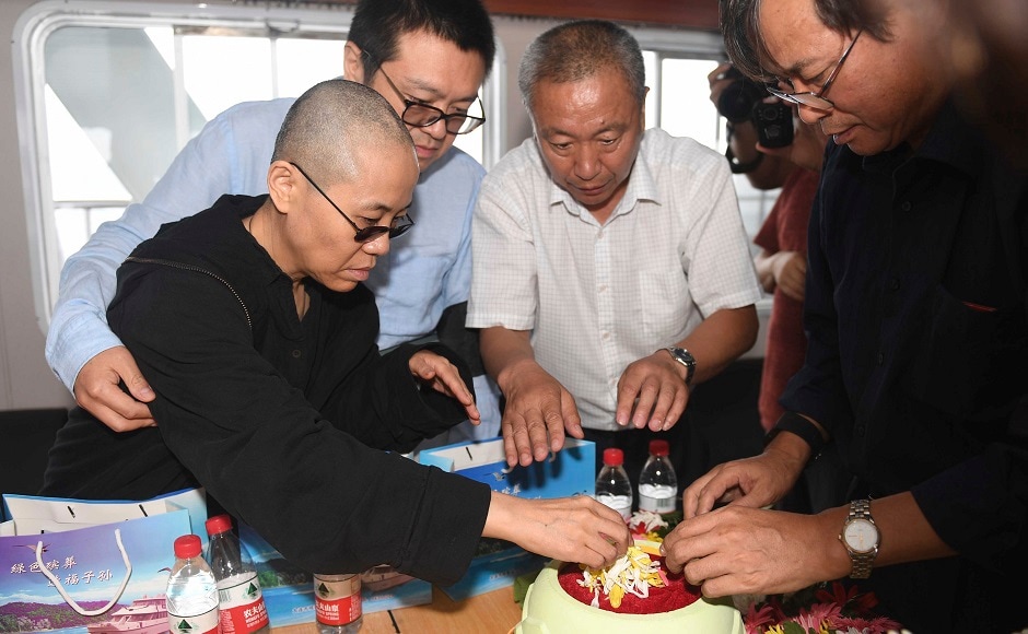 Liu's friends and family members bade him farewell in a private ceremony in North East China's Shenyang city. His wife prepared his ashes for burial at sea off the coast of Dalian in northeastern China's Liaoning Province. AP Liu's friends and family members bade him farewell in a private ceremony in North East China's Shenyang city. His wife prepared his ashes for burial at sea off the coast of Dalian in northeastern China's Liaoning Province. AP