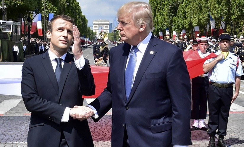 France president Emmanuel Macron with US president Donald Trump in their 25-second handshake. AP