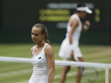 Magdalena Rybarikova walks away after losing a point to Spain’s Garbine Muguruza during their Women’s Singles semifinal match on day nine at the Wimbledon.. AP