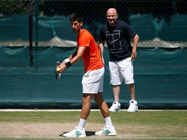 Serbia's Novak Djokovic in a training session with coach Andre Agassi. AP
