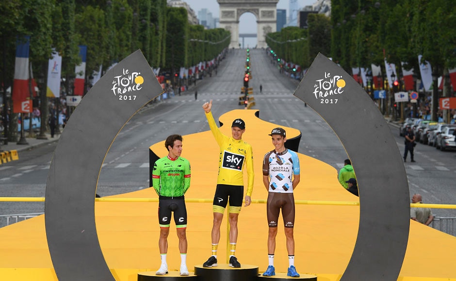 Tour de France winner Chris Froome, wearing the overall leader's yellow jersey, second place Rigoberto Uran of Colombia(L) and third place Romain Bardet of France (R) celebrate on the podium. AP Tour de France winner Chris Froome, wearing the overall leader's yellow jersey, second place Rigoberto Uran of Colombia(L) and third place Romain Bardet of France (R) celebrate on the podium. AP