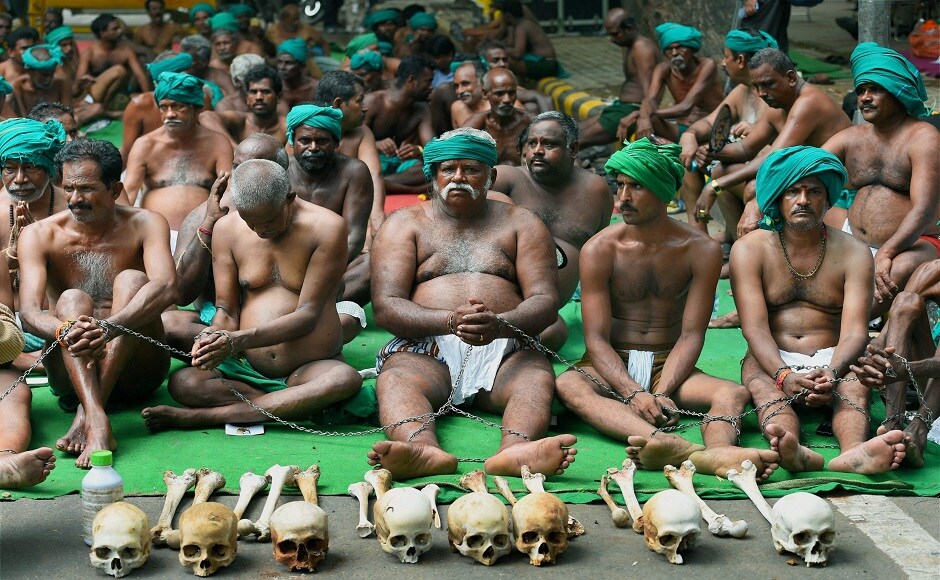 Scores of Tamil Nadu farmers, who had grabbed eyeballs with their unique protest earlier in the year, landed at New Delhi to resume their agitation for loan waiver and drought-relief package on Sunday. PTI Scores of Tamil Nadu farmers, who had grabbed eyeballs with their unique protest earlier in the year, landed at New Delhi to resume their agitation for loan waiver and drought-relief package on Sunday. PTI